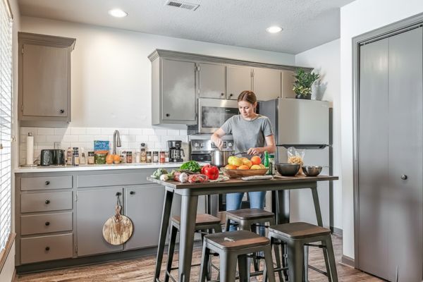 Person preparing food in modern kitchen.